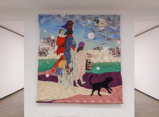 Colorful fabric hung in the space of the Arsenal Gallery, white walls.